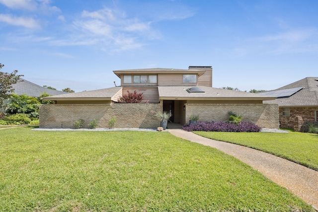 240 Shady Hill Dr, Richardson, TX 75080 - view of front facade featuring brick siding and a front yard
