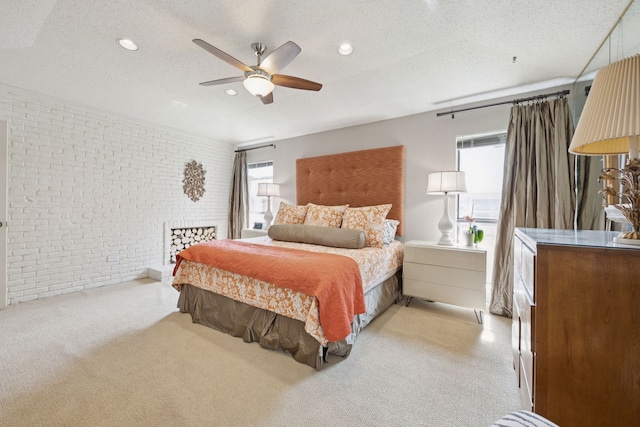 240 Shady Hill Dr, Richardson, TX 75080 - bedroom with brick wall, light colored carpet, a textured ceiling, recessed lighting, and a ceiling fan