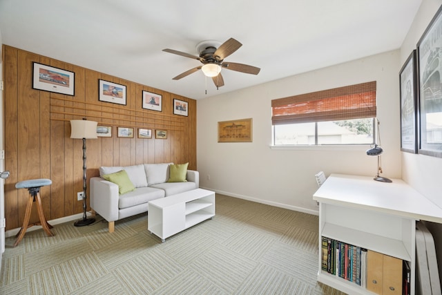 240 Shady Hill Dr, Richardson, TX 75080 - living room with wood walls, carpet, and ceiling fan