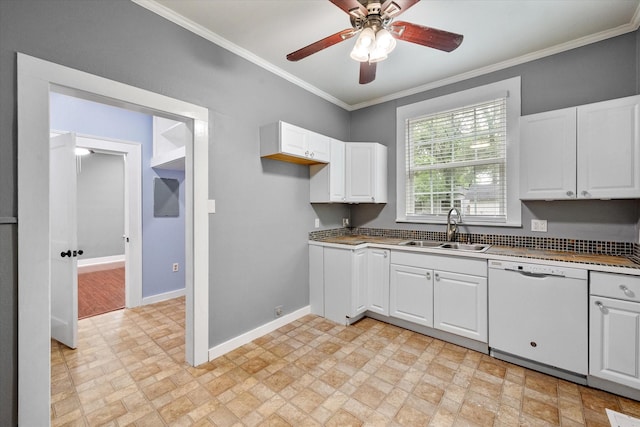 1301 W 2nd Ave, Corsicana, TX 75110 - kitchen with white dishwasher, ceiling fan, crown molding, white cabinets, and brick patterned floors