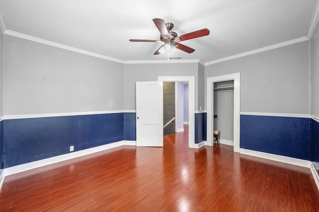 1301 W 2nd Ave, Corsicana, TX 75110 - unfurnished bedroom featuring crown molding, wood finished floors, and ceiling fan