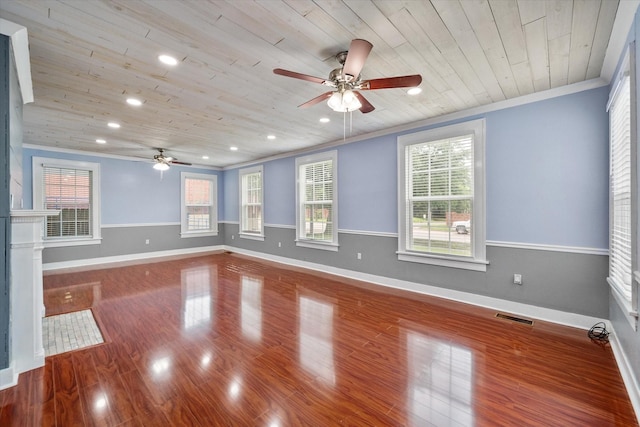 1301 W 2nd Ave, Corsicana, TX 75110 - empty room featuring a ceiling fan, wood ceiling, healthy amount of natural light, crown molding, and wood finished floors