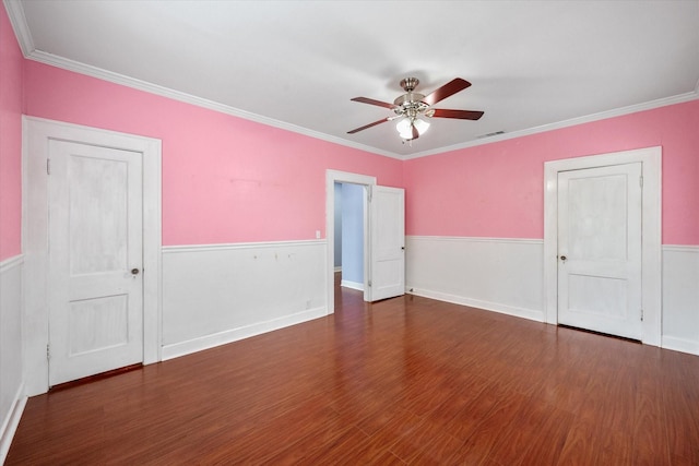 1301 W 2nd Ave, Corsicana, TX 75110 - unfurnished room with a wainscoted wall, a ceiling fan, wood finished floors, and ornamental molding