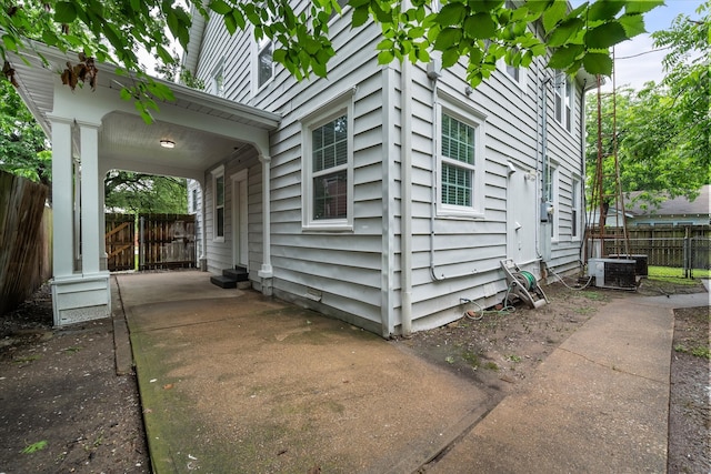 1301 W 2nd Ave, Corsicana, TX 75110 - view of side of home featuring a cooling unit