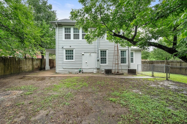 1301 W 2nd Ave, Corsicana, TX 75110 - rear view of house with a fenced backyard