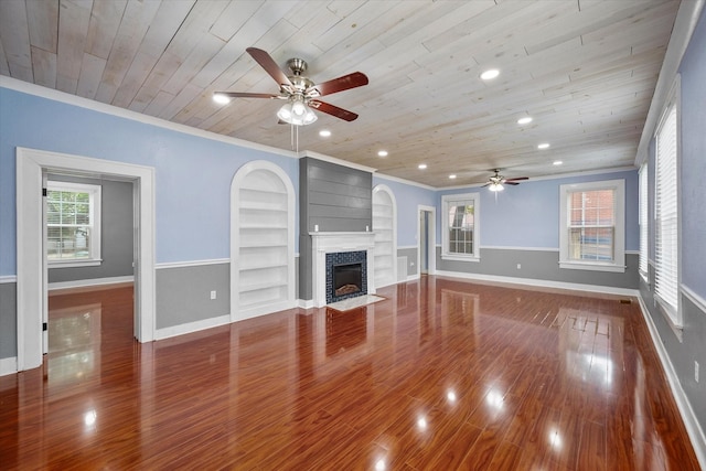 1301 W 2nd Ave, Corsicana, TX 75110 - unfurnished living room featuring a ceiling fan, wooden ceiling, built in shelves, a fireplace with flush hearth, and wood finished floors