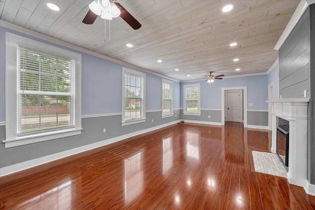 1301 W 2nd Ave, Corsicana, TX 75110 - unfurnished living room with a ceiling fan, wooden ceiling, plenty of natural light, ornamental molding, and a fireplace with flush hearth