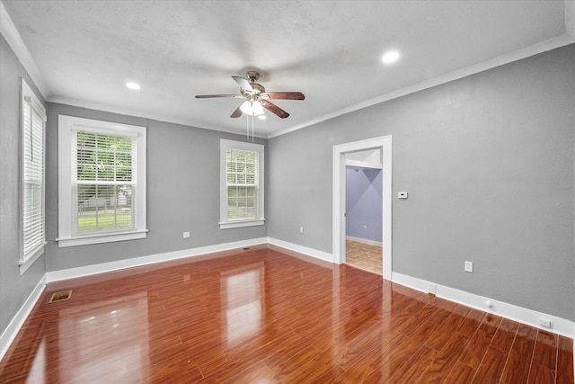1301 W 2nd Ave, Corsicana, TX 75110 - unfurnished room with ceiling fan, wood finished floors, recessed lighting, and ornamental molding