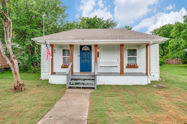 1505 W St, Mckinney, TX 75069 - bungalow-style house featuring a porch, a front lawn, and roof with shingles