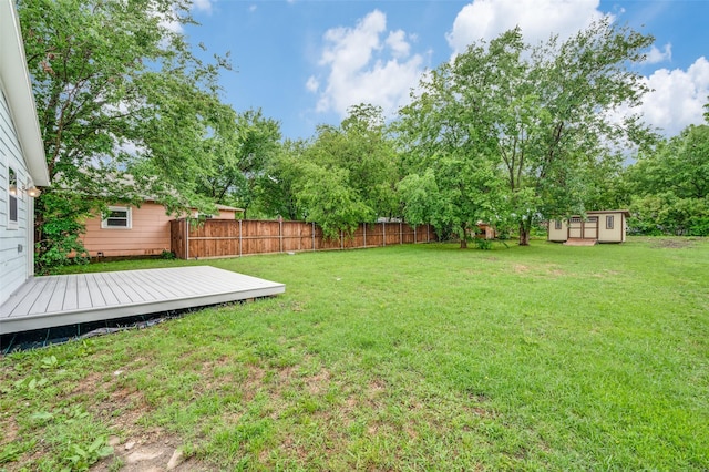 1505 W St, Mckinney, TX 75069 - view of yard featuring an outdoor structure and a wooden deck
