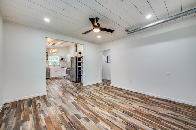 1505 W St, Mckinney, TX 75069 - unfurnished living room with wood finished floors, ceiling fan, recessed lighting, and wood ceiling