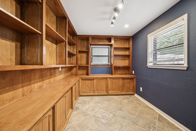 6209 Sierra Ct, Arlington, TX 76016 - unfurnished office with baseboards and light stone finish floors