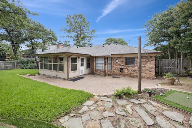 6209 Sierra Ct, Arlington, TX 76016 - back of house with a patio area, a putting area, a fenced backyard, and a shingled roof