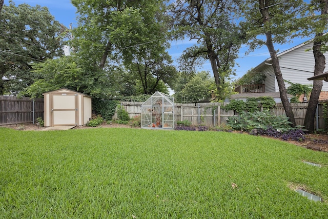6209 Sierra Ct, Arlington, TX 76016 - fenced backyard featuring a storage unit and an exterior structure