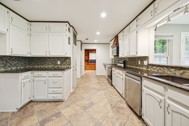 6209 Sierra Ct, Arlington, TX 76016 - kitchen with appliances with stainless steel finishes, tasteful backsplash, recessed lighting, and white cabinetry