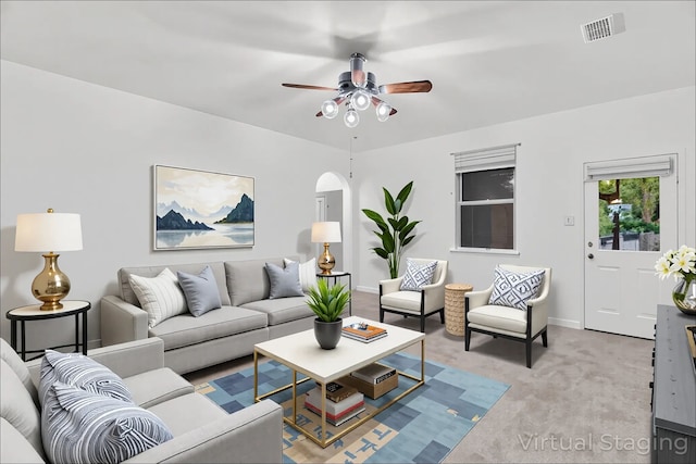161 Collin St, Anna, TX 75409 - living area featuring arched walkways, light colored carpet, and a ceiling fan