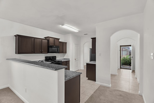 161 Collin St, Anna, TX 75409 - kitchen with black appliances, arched walkways, dark brown cabinets, light tile patterned floors, and a peninsula