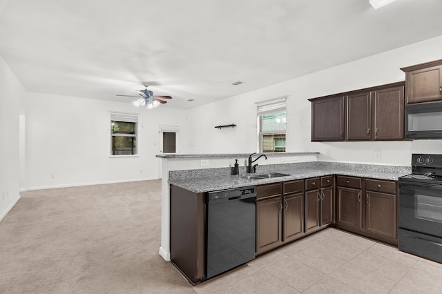 161 Collin St, Anna, TX 75409 - kitchen featuring black appliances, dark brown cabinets, a peninsula, ceiling fan, and open floor plan