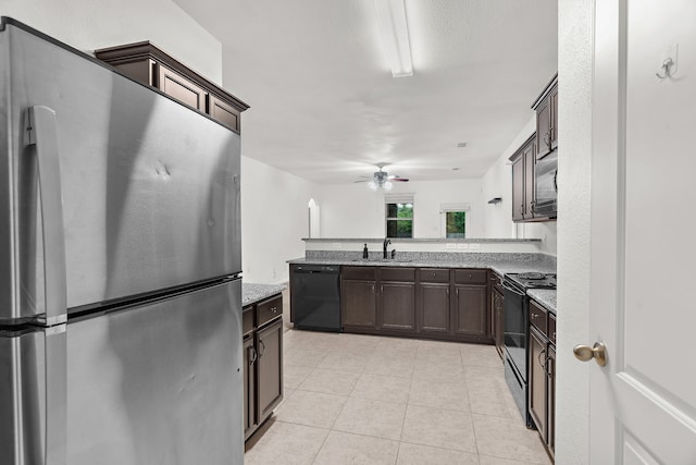 161 Collin St, Anna, TX 75409 - kitchen with black appliances, dark brown cabinets, a ceiling fan, light tile patterned floors, and a peninsula