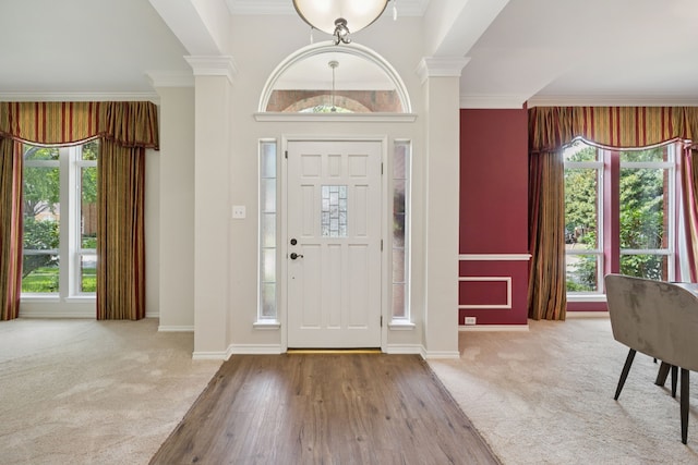 2001 Elm Creek Ln, Flower Mound, TX 75028 - foyer entrance featuring ornate columns, crown molding, and carpet flooring