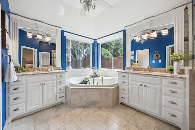 2001 Elm Creek Ln, Flower Mound, TX 75028 - full bath with two vanities, ceiling fan, and a garden tub