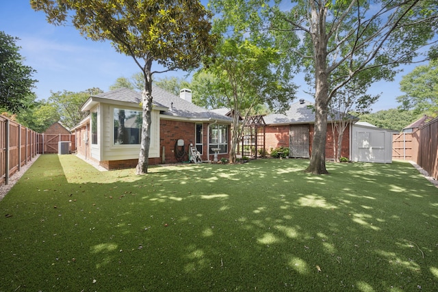 2001 Elm Creek Ln, Flower Mound, TX 75028 - back of house with a storage shed, a fenced backyard, a chimney, and brick siding