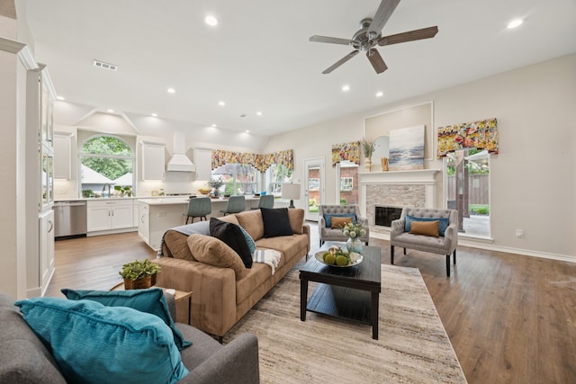2001 Elm Creek Ln, Flower Mound, TX 75028 - living room featuring light wood-type flooring, ceiling fan, a fireplace, and recessed lighting