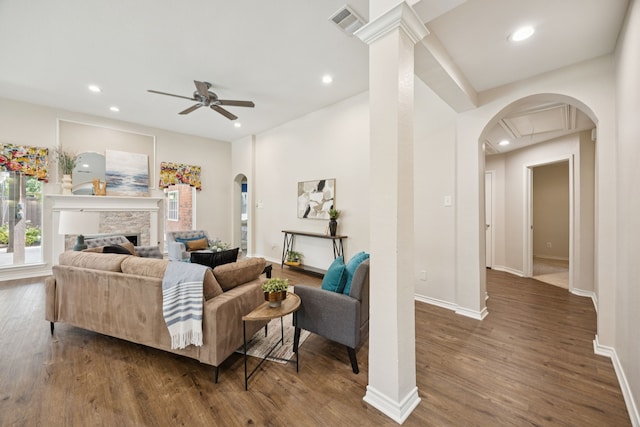 2001 Elm Creek Ln, Flower Mound, TX 75028 - living area with arched walkways, ceiling fan, wood finished floors, healthy amount of natural light, and recessed lighting