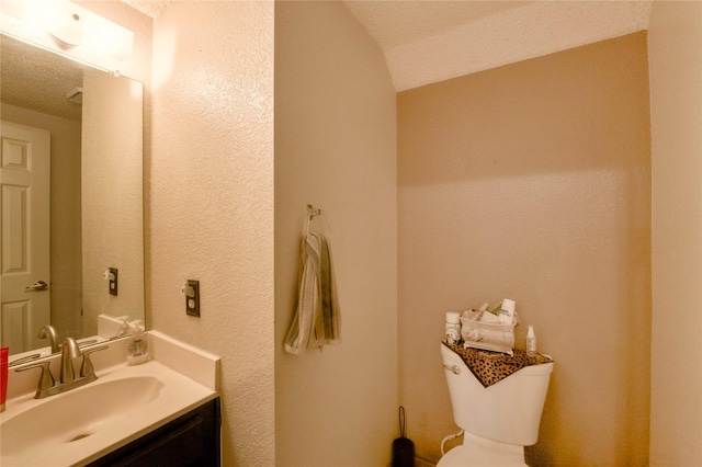 2315 Rockhill Rd, Mckinney, TX 75072 - half bath with vanity and a textured ceiling