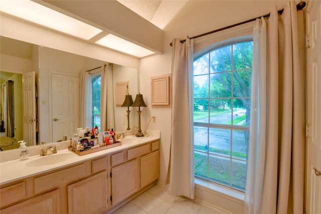 2315 Rockhill Rd, Mckinney, TX 75072 - bathroom featuring double vanity and baseboards