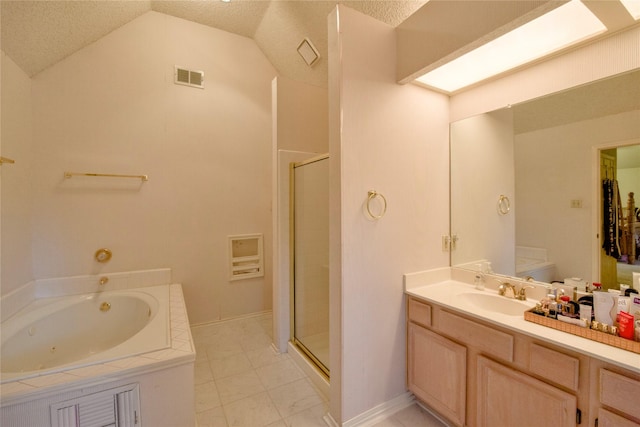 2315 Rockhill Rd, Mckinney, TX 75072 - bathroom featuring a stall shower, lofted ceiling, vanity, a whirlpool tub, and a textured ceiling