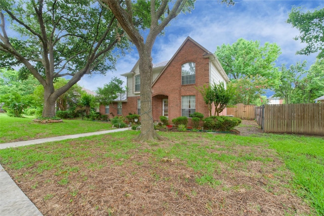 2315 Rockhill Rd, Mckinney, TX 75072 - traditional-style home featuring brick siding and a gate