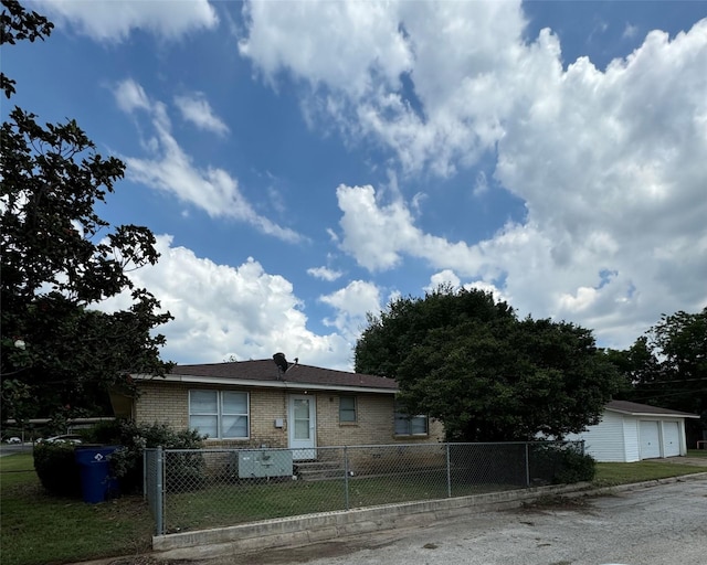 1402 Vine St, Bridgeport, TX 76426 - ranch-style home featuring brick siding, a fenced front yard, and a garage