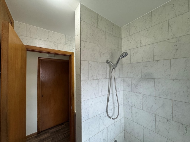 1402 Vine St, Bridgeport, TX 76426 - bathroom with a tile shower and wood finished floors