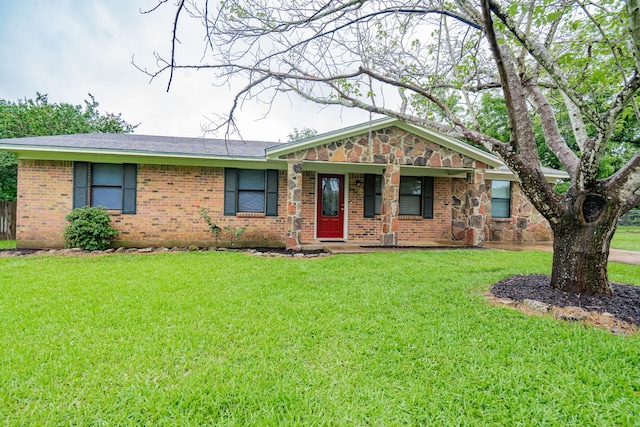208 De Gail St, Grand Saline, TX 75140 - view of front of property featuring brick siding, a front yard, and covered porch
