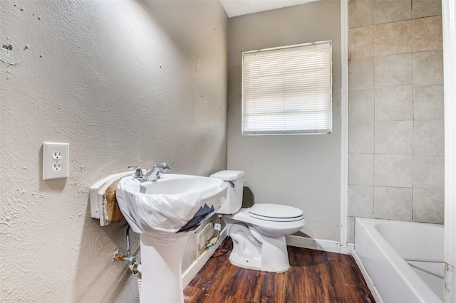 811 Tarryall Dr, Dallas, TX 75224 - bathroom featuring toilet and wood finished floors
