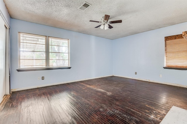 811 Tarryall Dr, Dallas, TX 75224 - spare room featuring ceiling fan, wood-type flooring, and a textured ceiling
