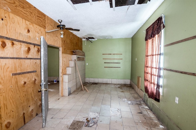 811 Tarryall Dr, Dallas, TX 75224 - spare room featuring ceiling fan and a textured ceiling