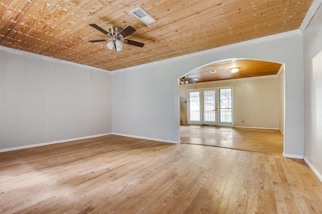 811 Tarryall Dr, Dallas, TX 75224 - empty room with ceiling fan, crown molding, arched walkways, hardwood / wood-style floors, and wooden ceiling