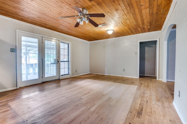 811 Tarryall Dr, Dallas, TX 75224 - unfurnished room with arched walkways, crown molding, wood ceiling, ceiling fan, and light wood-style floors
