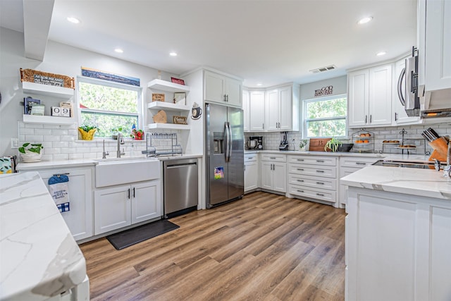 3135 Brazos River Dr, Granbury, TX 76048 - kitchen with stainless steel appliances, open shelves, decorative backsplash, and recessed lighting