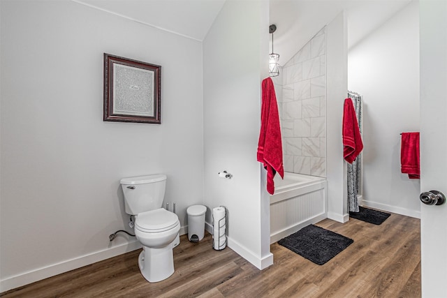 3135 Brazos River Dr, Granbury, TX 76048 - bathroom featuring wood finished floors, vaulted ceiling, and shower / bath combo