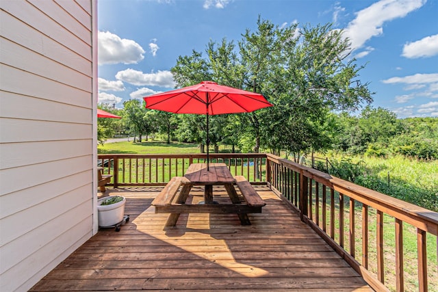 3135 Brazos River Dr, Granbury, TX 76048 - wooden deck with outdoor dining space and a lawn
