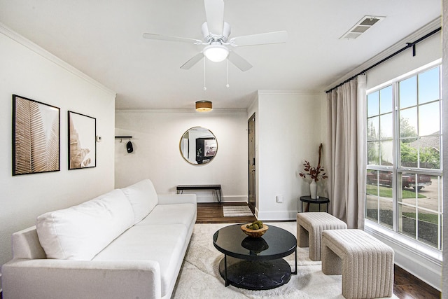 6833 Permian Ln, Fort Worth, TX 76137 - living room with wood finished floors, crown molding, and ceiling fan
