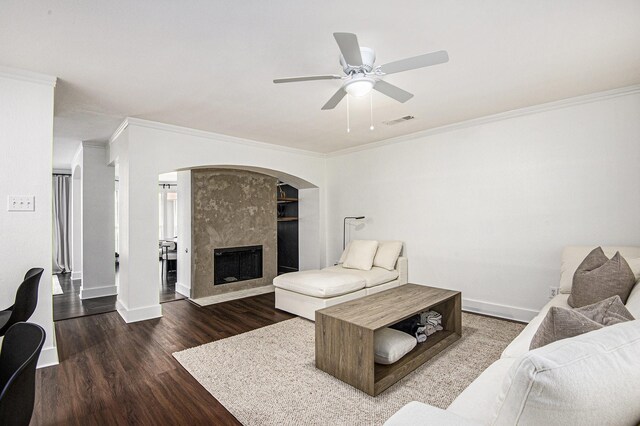 6833 Permian Ln, Fort Worth, TX 76137 - living area featuring crown molding, wood finished floors, a high end fireplace, and a ceiling fan