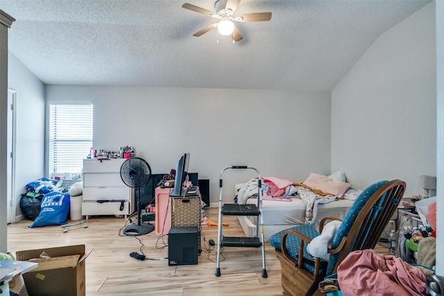 1612 Hackamore St, Mesquite, TX 75149 - bedroom with a textured ceiling, wood finished floors, vaulted ceiling, and ceiling fan