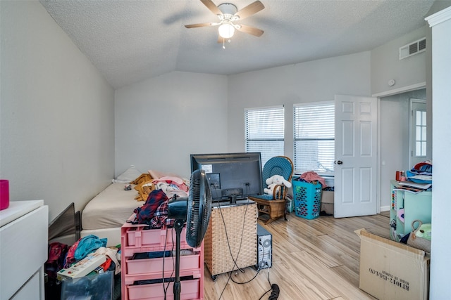 1612 Hackamore St, Mesquite, TX 75149 - bedroom with wood finished floors, a textured ceiling, vaulted ceiling, and a ceiling fan