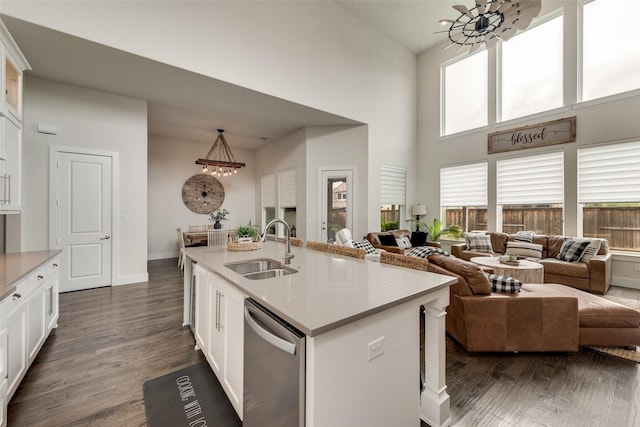 3900 Brazoria Dr, Prosper, TX 75078 - kitchen with dishwasher, a chandelier, a towering ceiling, light countertops, and dark wood-style flooring