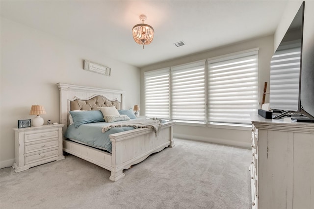 3900 Brazoria Dr, Prosper, TX 75078 - bedroom featuring light carpet and a chandelier