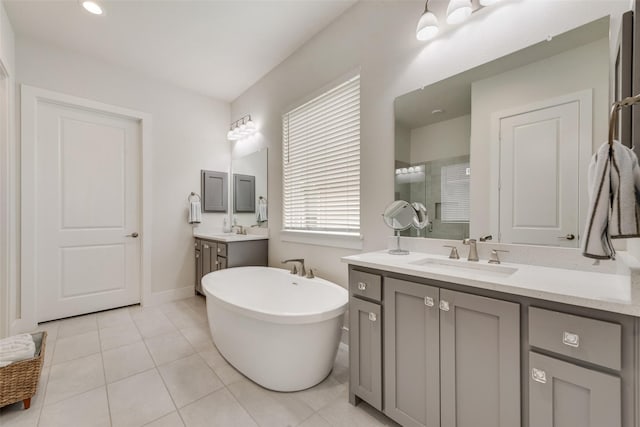 3900 Brazoria Dr, Prosper, TX 75078 - bathroom with an enclosed shower, a freestanding tub, two vanities, and tile patterned flooring